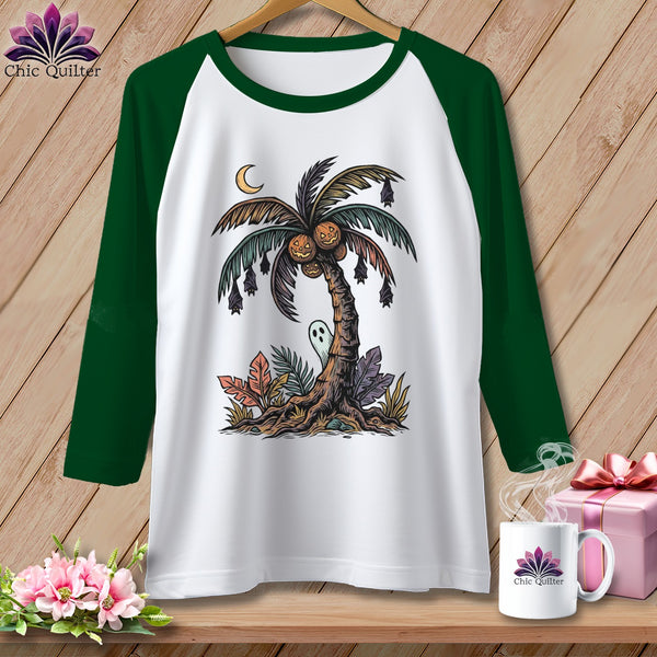 White raglan shirt with Halloween palm tree graphic, bats, pumpkins, ghost, and moon.