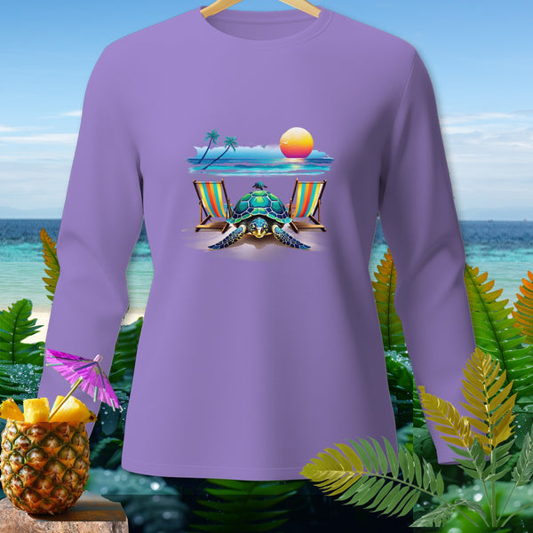 Purple long-sleeve shirt with a beach scene featuring a turtle, lounge chairs, and a sunset.