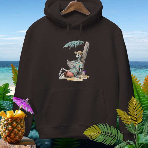 Skeleton on beach reading "How to Relax" book under palm tree.