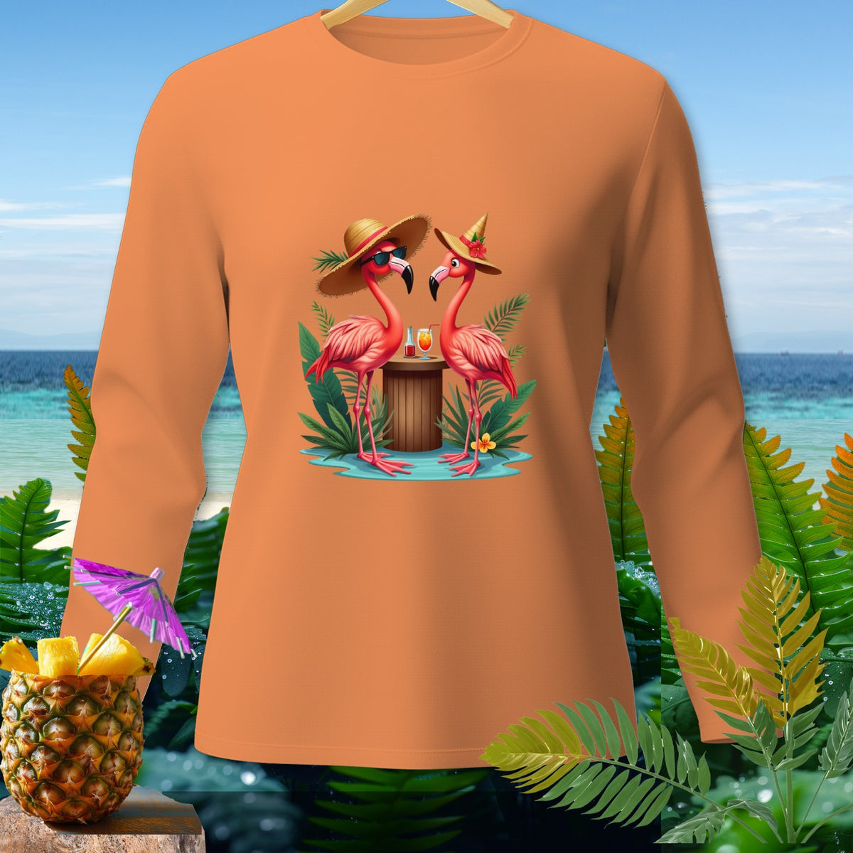 Orange long-sleeve shirt with a tropical flamingo graphic and pineapple garnish.