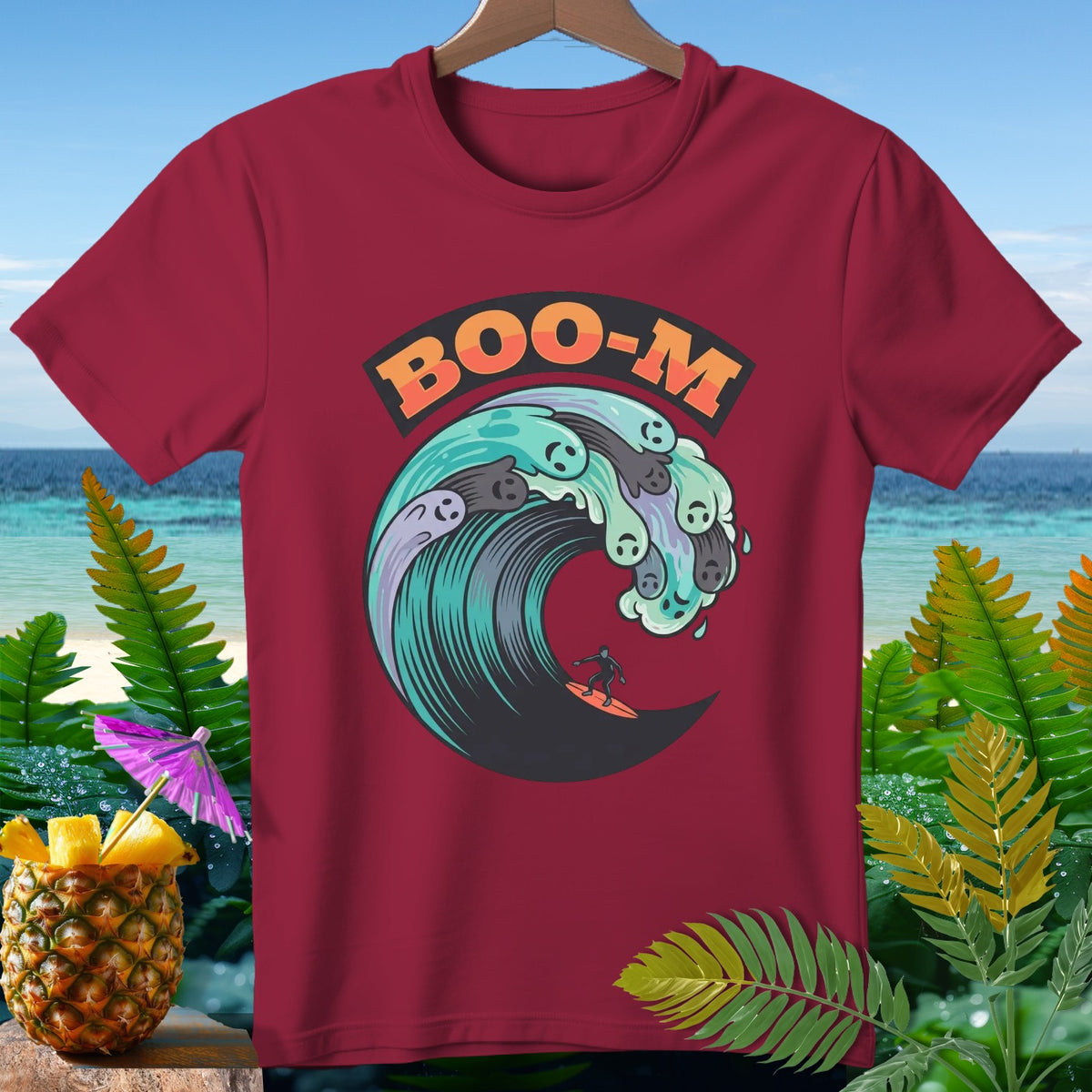 T-shirt with "BOO-M" text above surfing ghosts in a wave.