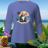 Long-sleeve purple shirt with a sloth on a beach at sunset graphic.