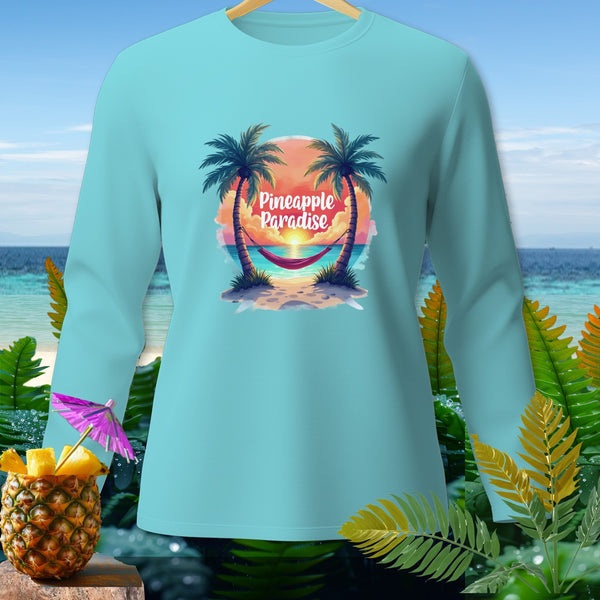 Light blue long-sleeved shirt with "Pineapple Paradise" text over a tropical beach scene.