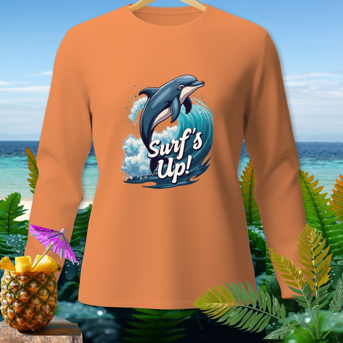 Orange long-sleeve shirt with dolphin jumping through wave graphic and "Surf's Up!" text.