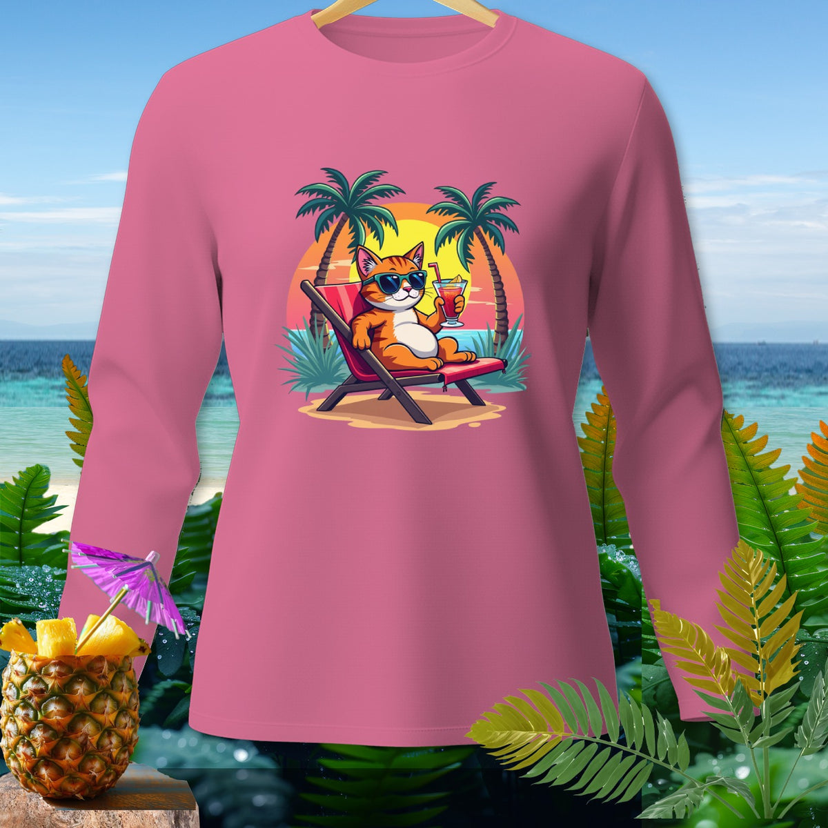 Pink long-sleeve shirt with a graphic of a cat relaxing on a beach chair with a drink.
