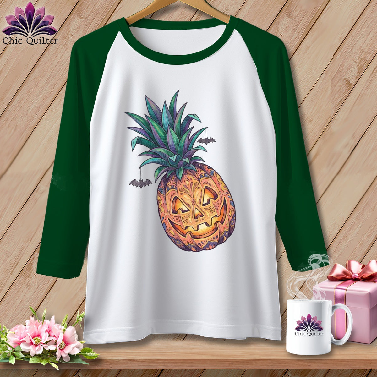 White baseball tee with a Halloween pineapple graphic and bats.