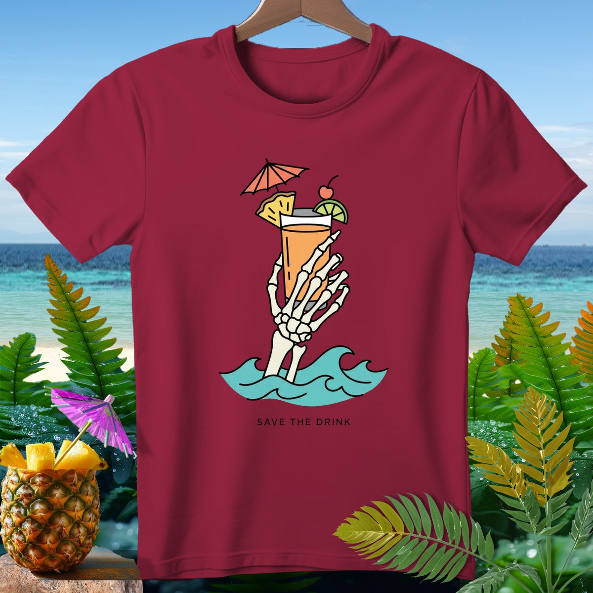 Skeleton hand holding a cocktail in waves, "SAVE THE DRINK" text.
