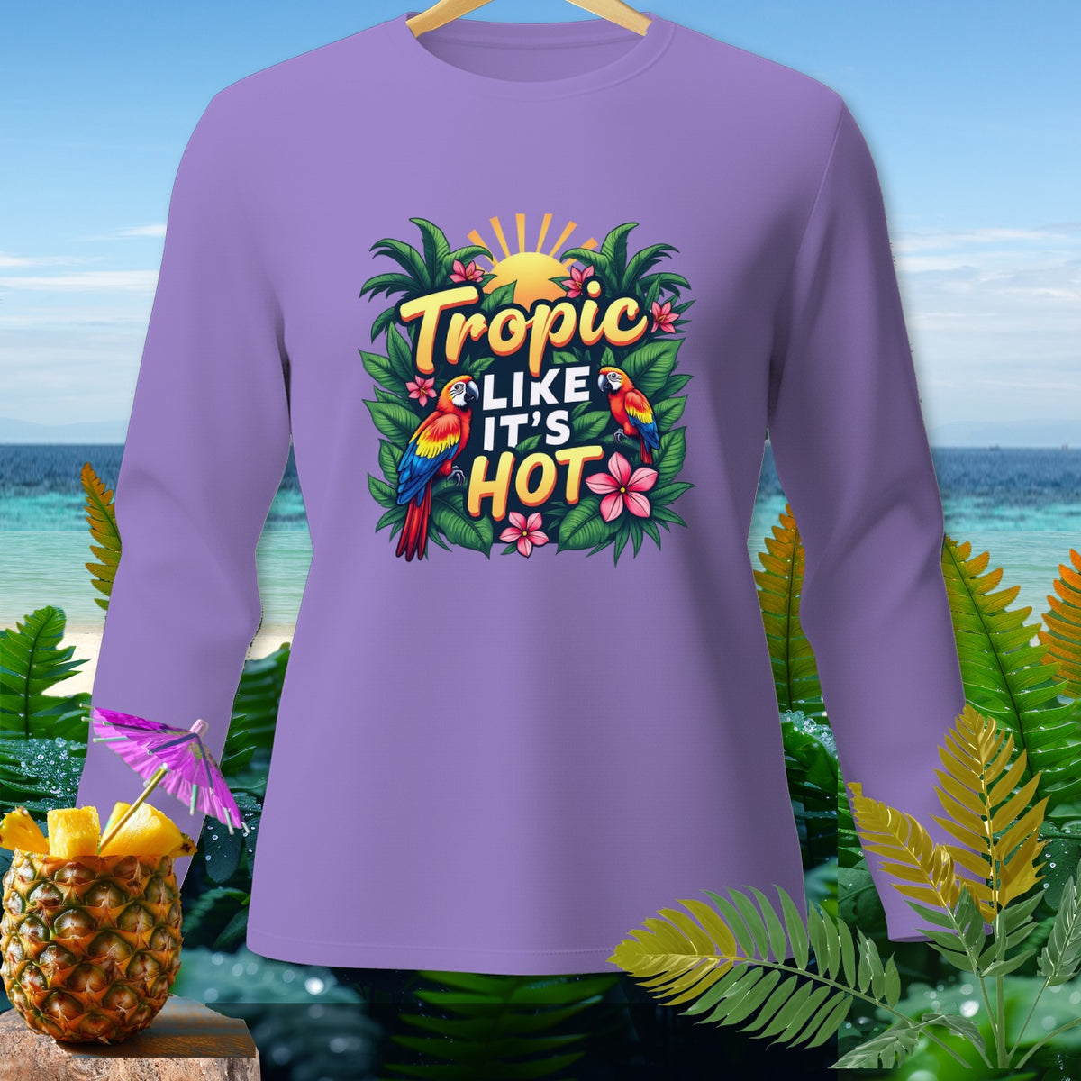 Purple long-sleeve shirt with "Tropic Like It's Hot" text and parrots.