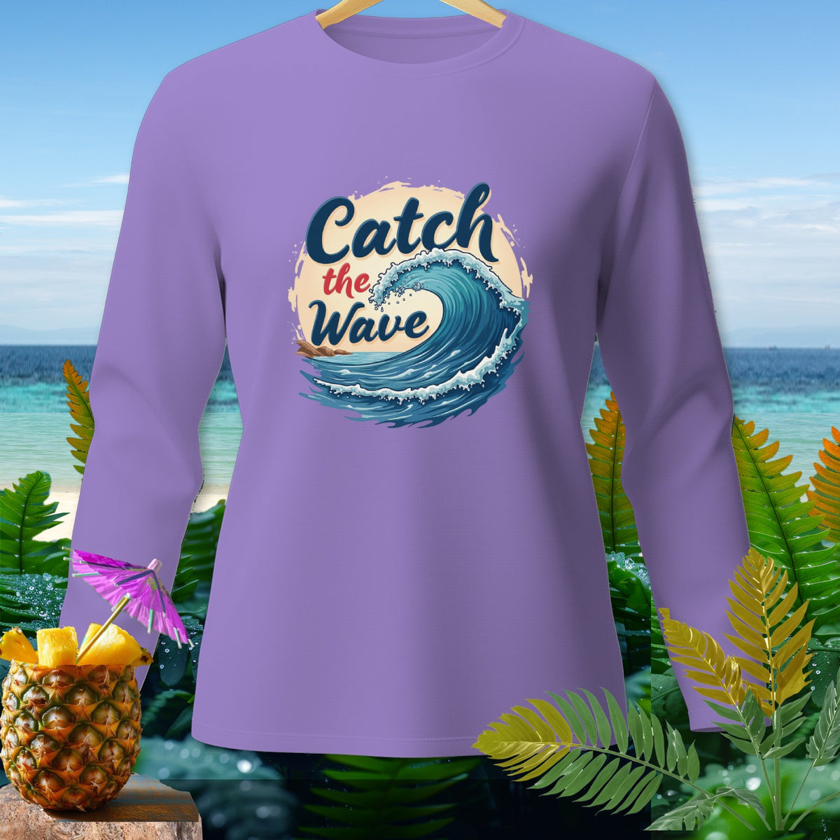 Lavender long-sleeve shirt with "Catch the Wave" ocean graphic.