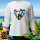 White long-sleeve shirt with graphic of sloth in a hammock on tropical beach sunset.