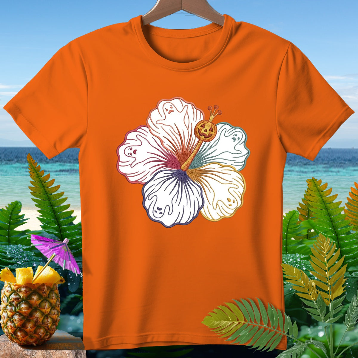 Orange t-shirt with white hibiscus flower design featuring ghosts and a jack-o'-lantern.