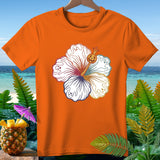 Orange t-shirt with white hibiscus flower design featuring ghosts and a jack-o'-lantern.