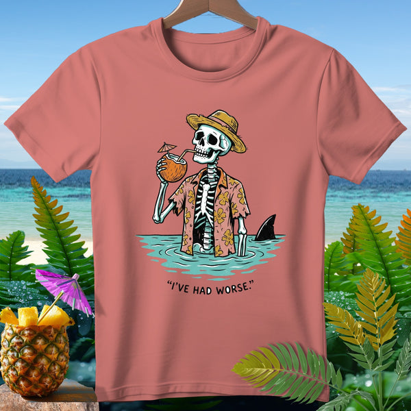 Skeleton in a Hawaiian shirt drinks from a coconut, with a shark fin nearby, and text.