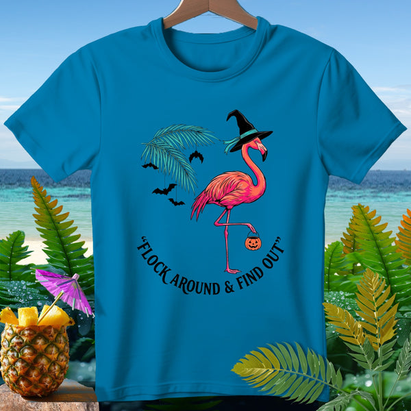 Turquoise t-shirt with a flamingo wearing a witch hat and holding a pumpkin, with text "Flock Around & Find Out".