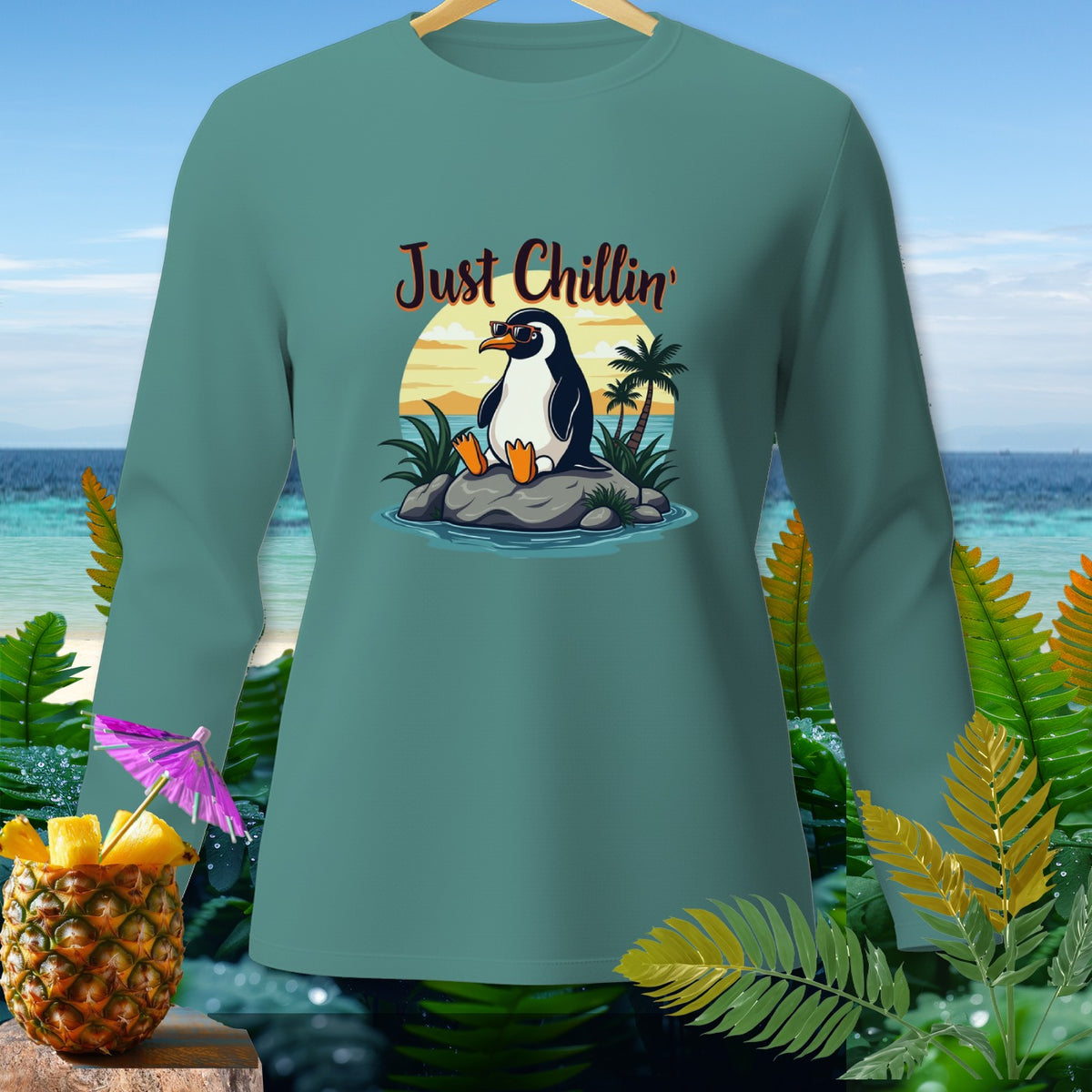 Long sleeve shirt with a cartoon penguin wearing sunglasses and the text "Just Chillin'".