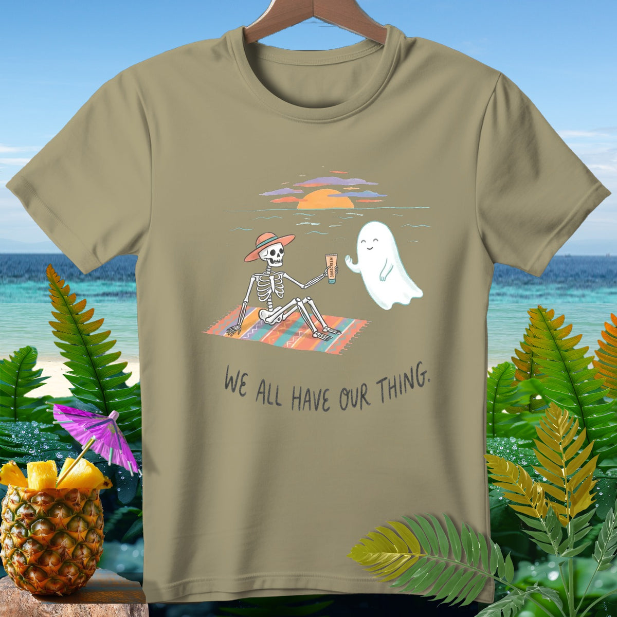 Skeleton and ghost relaxing on a beach blanket, with text "WE ALL HAVE OUR THING."