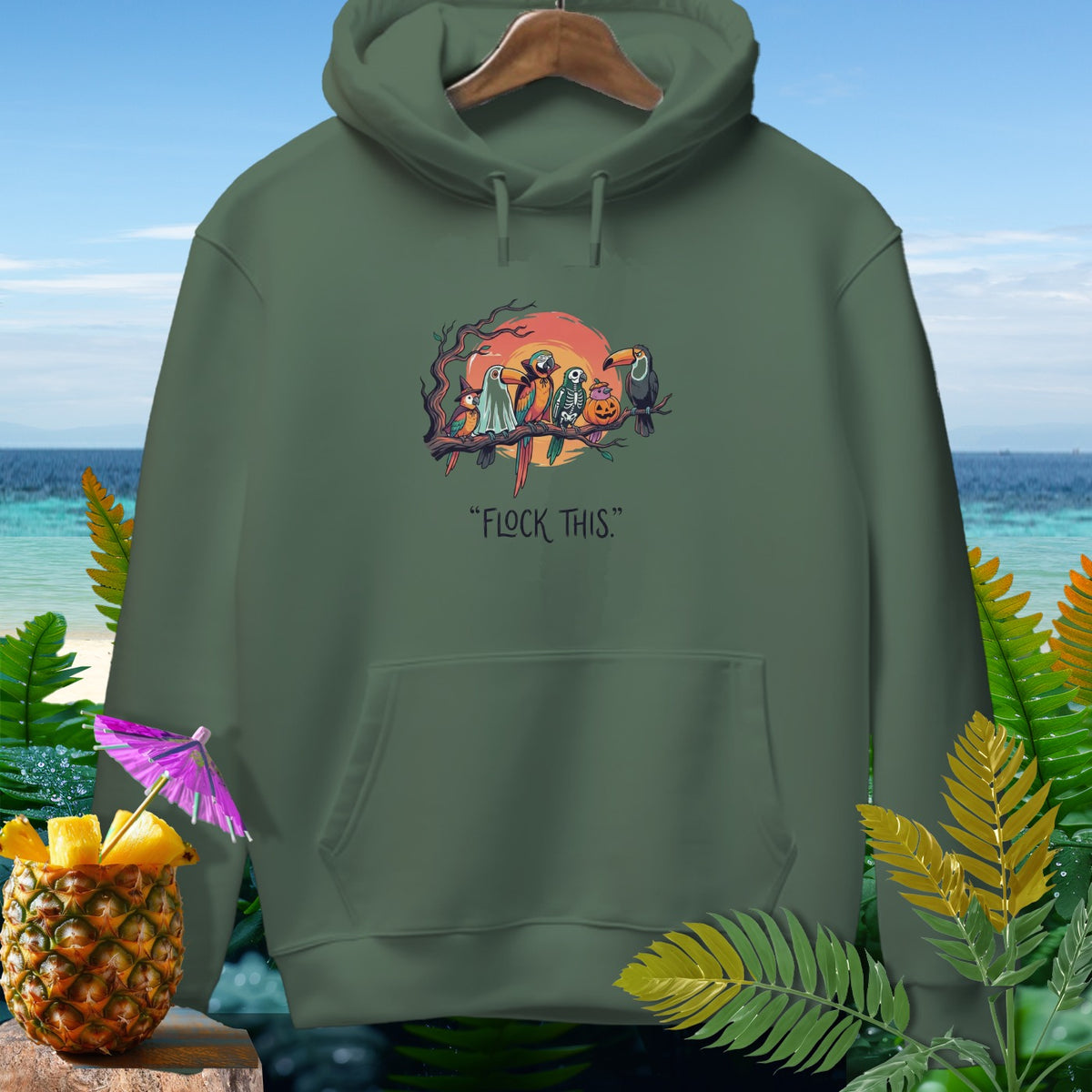 Green hoodie with Halloween-themed birds on a branch and "FLOCK THIS." text.