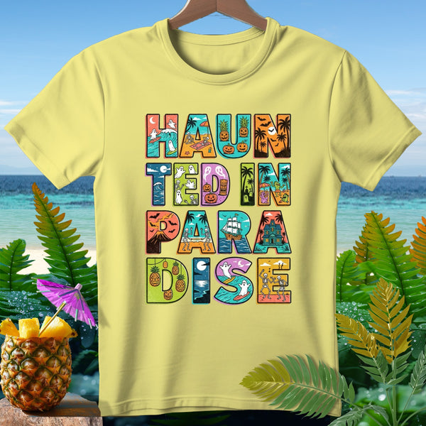 Yellow t-shirt with "HAUNTED IN PARADISE" text featuring Halloween and beach imagery.