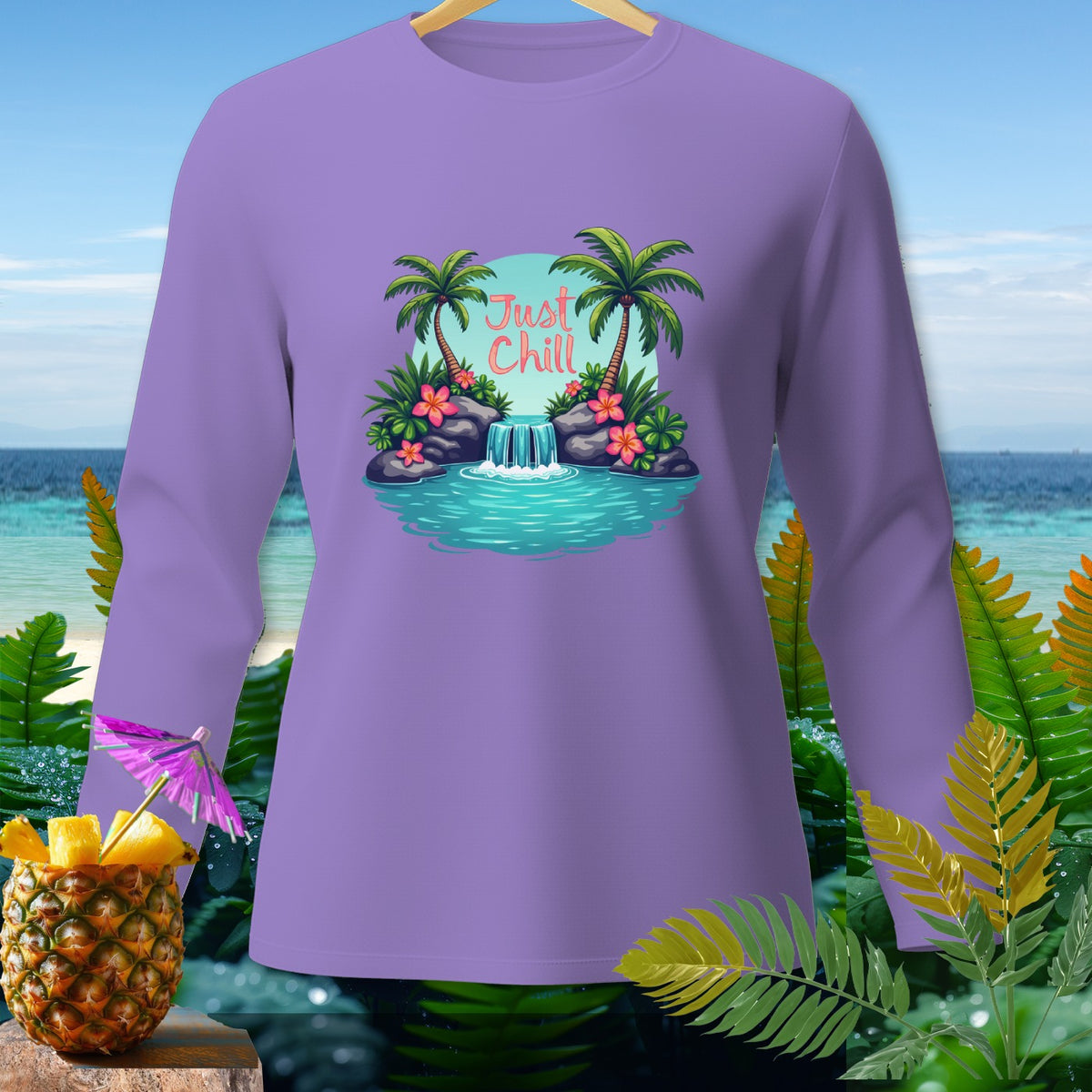 Lavender long-sleeve shirt with a tropical waterfall and palm tree graphic saying "Just Chill".