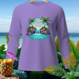 Lavender long-sleeve shirt with a tropical waterfall and palm tree graphic saying 