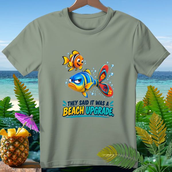 T-shirt with cartoon fish and text "They said it was a beach upgrade."