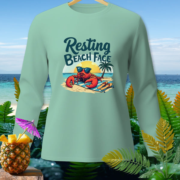 Mint long-sleeve shirt with a cartoon lobster on a beach, reading "Resting Beach Face".