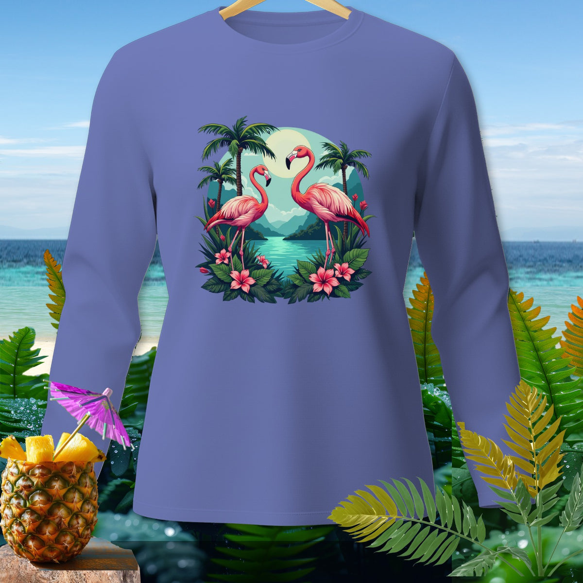 Long sleeve shirt with two pink flamingos, palm trees, and tropical flowers.