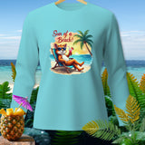 Light blue long-sleeve shirt with a cartoon fox on a beach chair and text 