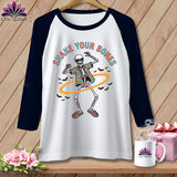 T-shirt with a dancing skeleton graphic and the text 