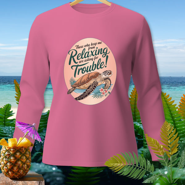 Pink long-sleeve shirt with a graphic of a turtle and text about relaxing.