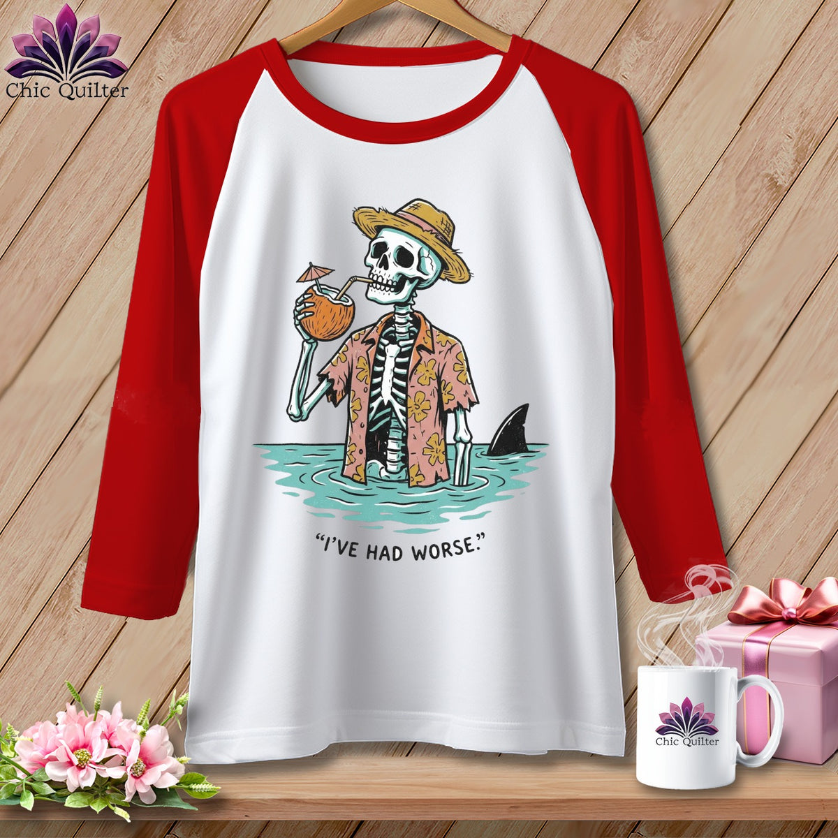 White t-shirt with red sleeves featuring a skeleton in a Hawaiian shirt drinking from a coconut, with a shark fin.