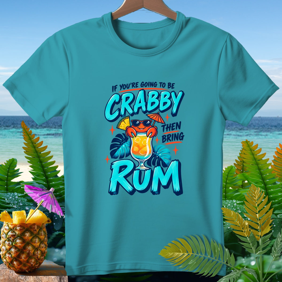 Teal t-shirt with "If you're going to be crabby then bring rum" text and crab graphic.