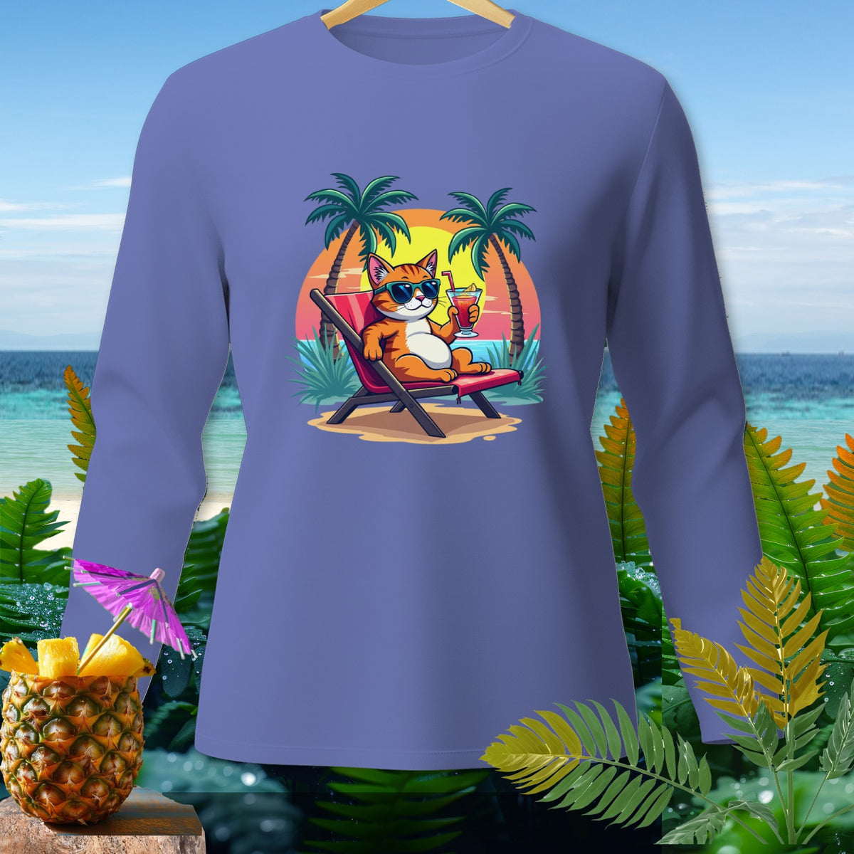 Purple long-sleeve shirt with illustration of cat relaxing on beach with tropical drink.