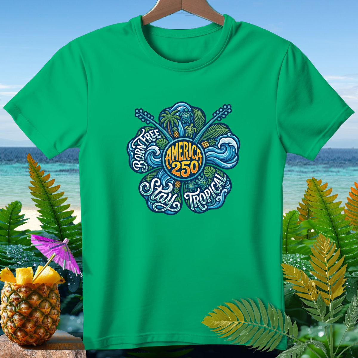 Green t-shirt with "Born Free America 250 Stay Tropical" floral graphic.