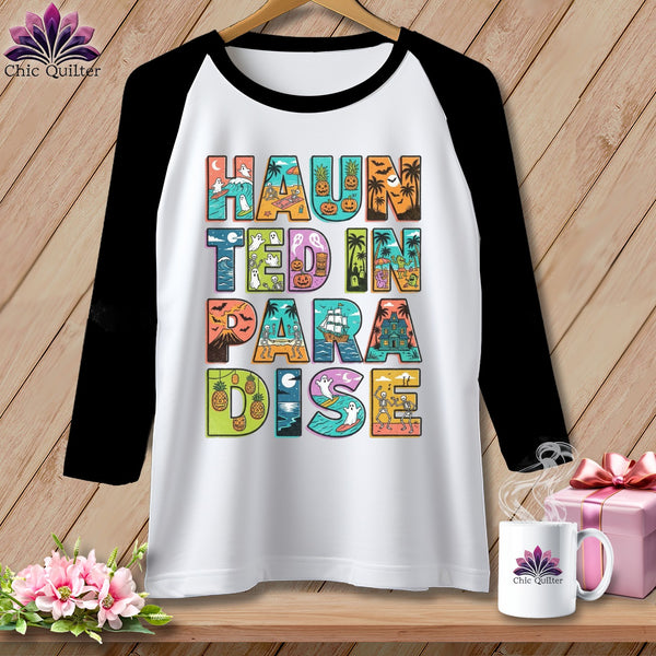 Raglan sleeve shirt with "Haunted in Paradise" text featuring Halloween and tropical imagery.