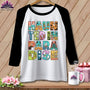 Raglan sleeve shirt with "Haunted in Paradise" text featuring Halloween and tropical imagery.