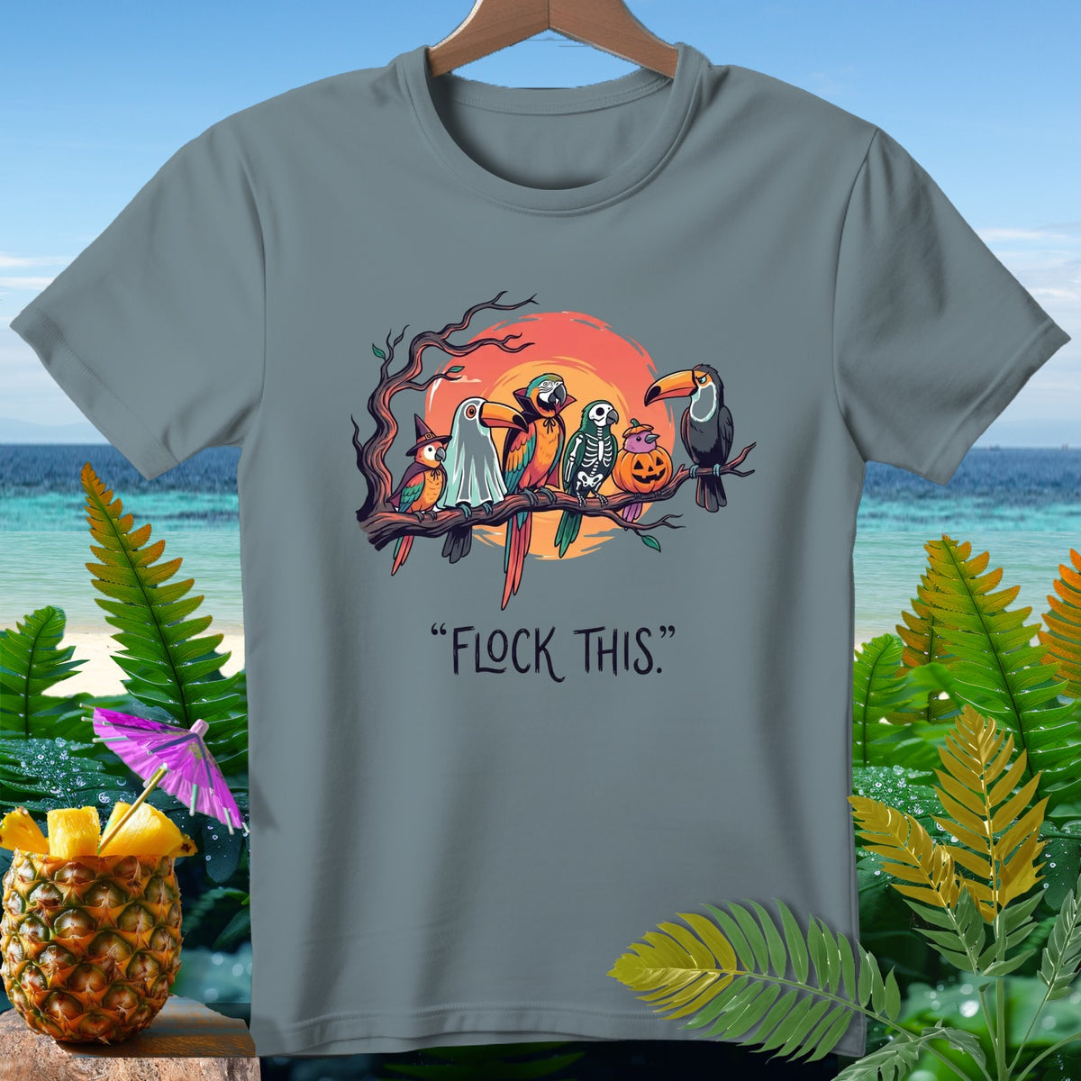 Parrots dressed for Halloween on a branch with text "FLOCK THIS?".