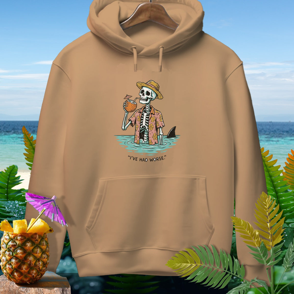 Skeleton in Hawaiian shirt drinking from coconut, with shark fin and text "I'VE HAD WORSE."