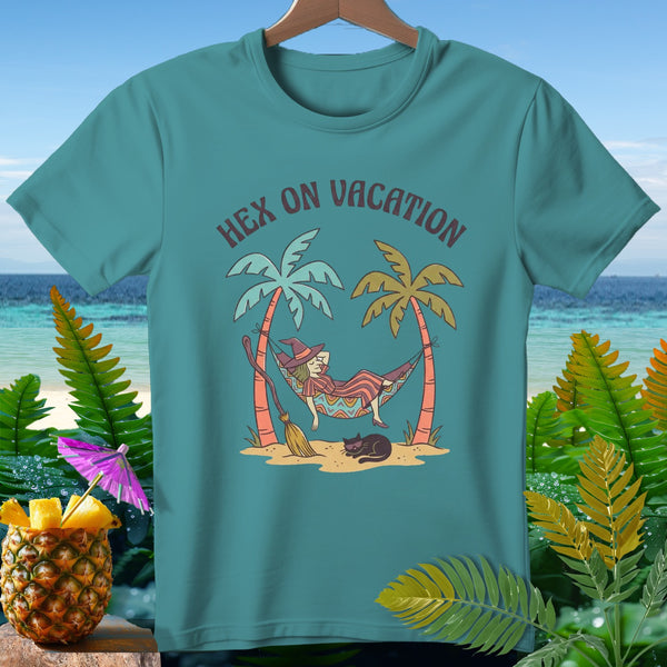 Teal t-shirt with witch, cat, and palm trees in hammock, reading "Hex On Vacation."