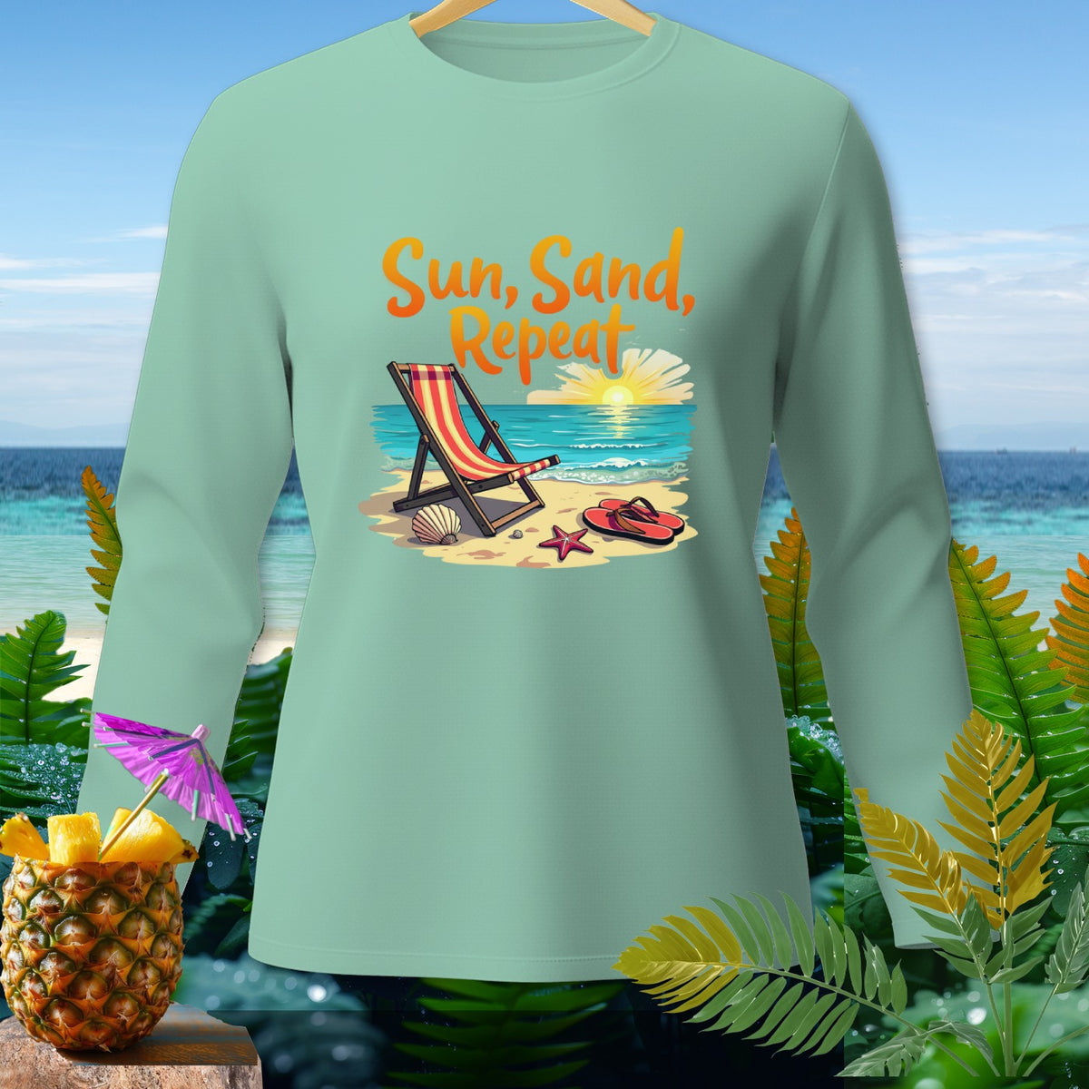 Light green long-sleeve shirt with "Sun, Sand, Repeat" beach graphic.