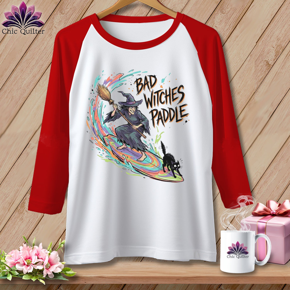 Raglan t-shirt with witch surfing on a rainbow wave with a black cat.