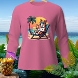 Pink long sleeve shirt featuring a dog relaxing on a beach chair with a drink.