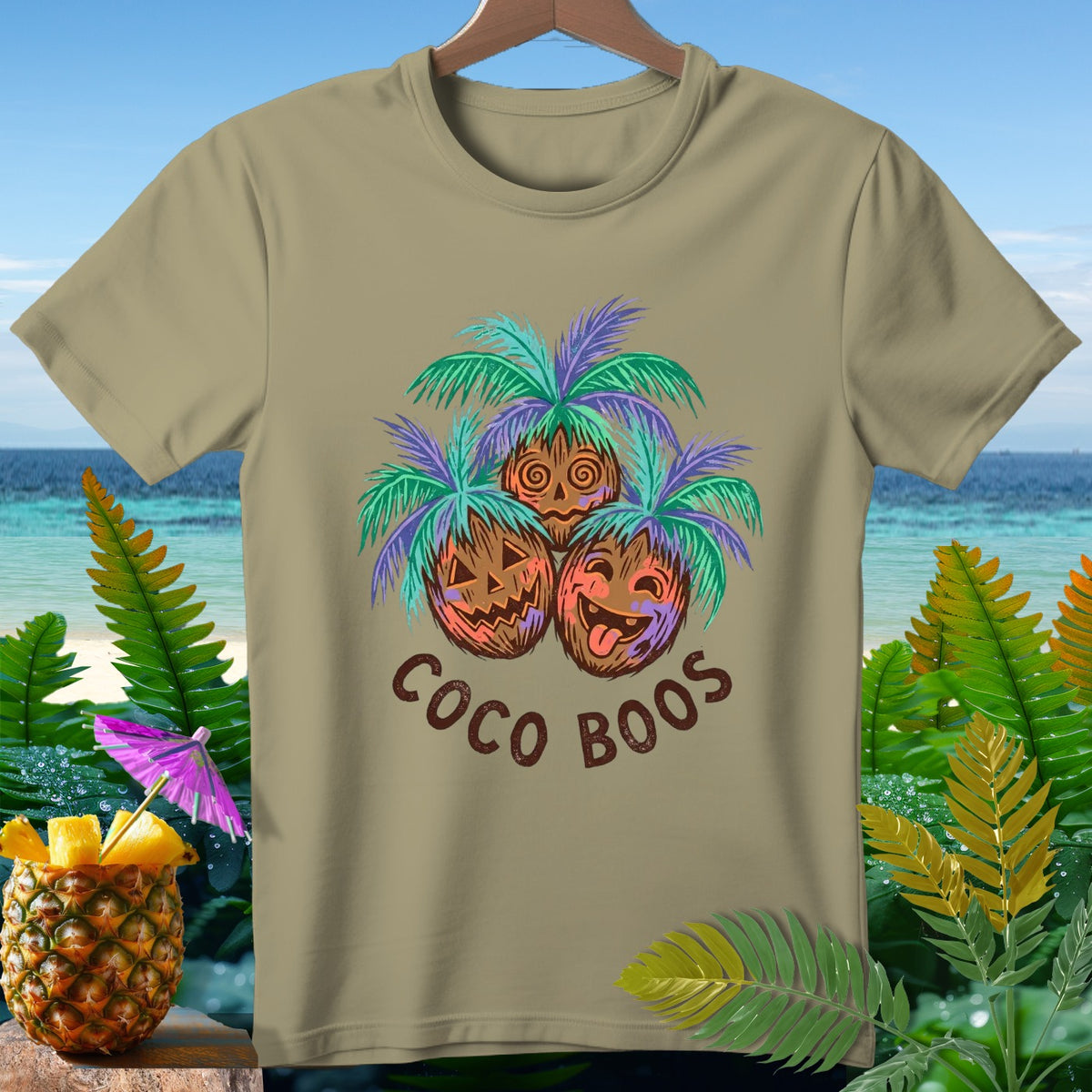 Khaki t-shirt with three coconuts and palm leaves, text "Coco Boos".