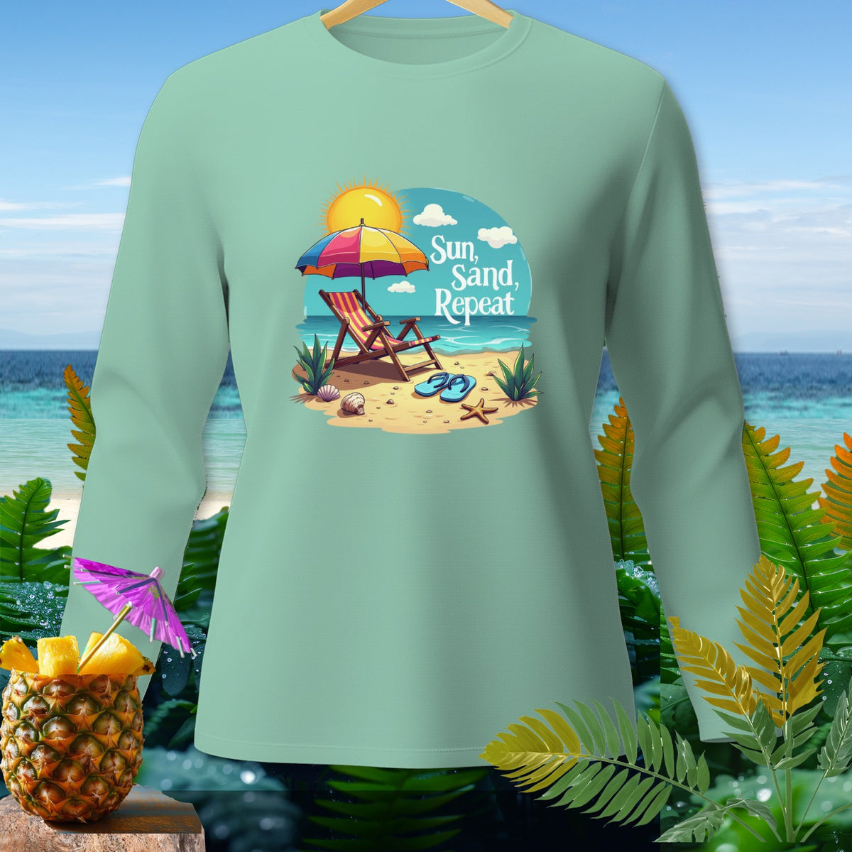 Mint long sleeve shirt with "Sun, Sand, Repeat" beach graphic.