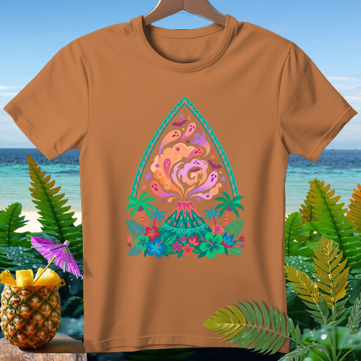 Brown t-shirt with colorful volcano, ghosts, bats, and tropical foliage design.