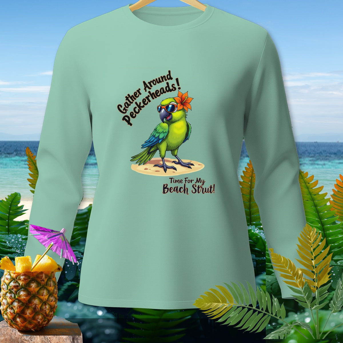 Light green long-sleeve shirt with a parrot graphic and beach-themed text.