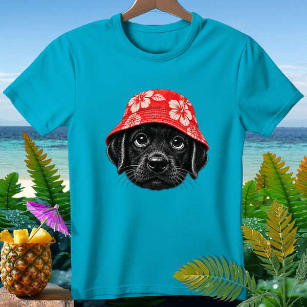 Turquoise t-shirt with a black lab puppy wearing a red hibiscus bucket hat.