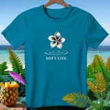Teal t-shirt with a white flower graphic and 