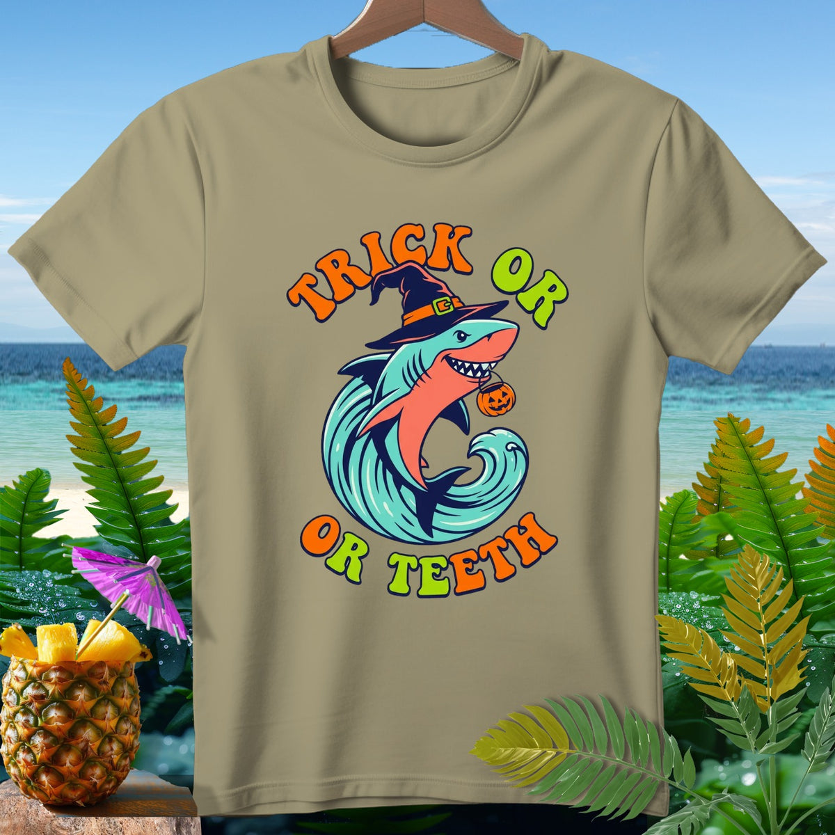 Shark in witch hat on wave with "Trick or Teeth" text, holding pumpkin.