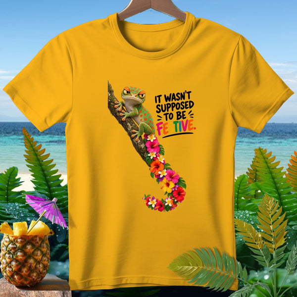 Yellow t-shirt with a gecko on a branch and text "It wasn't supposed to be festive".